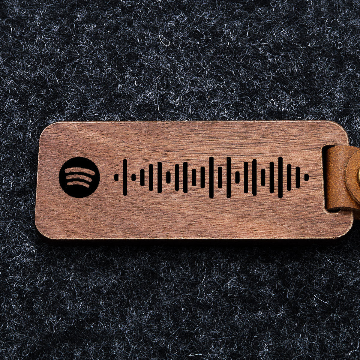 Gepersonaliseerde Spotify-sleutelhanger van hout. Gegraveerd met Spotify-code en slogan